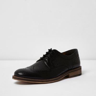 Black textured leather brogues